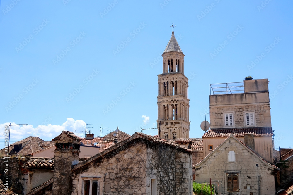 Old stone buildings and landmark Saint Domnoius bell tower in central Split, Croatia.
