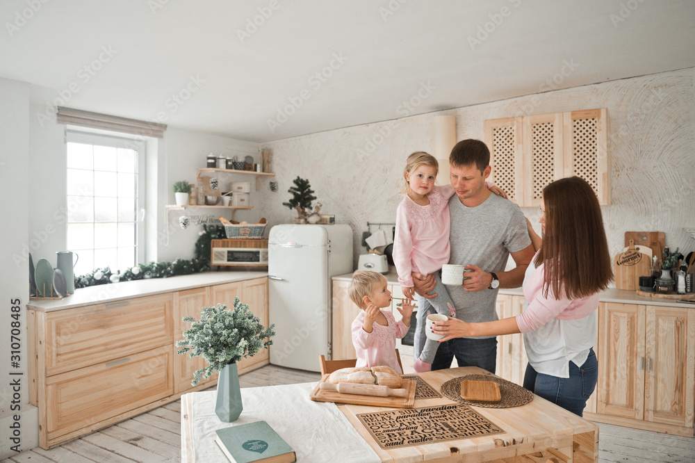 The kitchen chores of a young family to meet Christmas 2095. The kitchen chores of a young family to meet Christmas 2095.