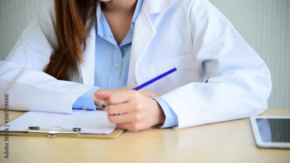 Woman doctor writing prescription for medical health care therapy professional specialist diagnostics at hospital medicare treatment clinic. close up female doctor hands write on diagnosis clip board Woman doctor writing prescription for medical health care therapy professional specialist diagnostics at hospital medicare treatment clinic. close up female doctor hands write on diagnosis clip board