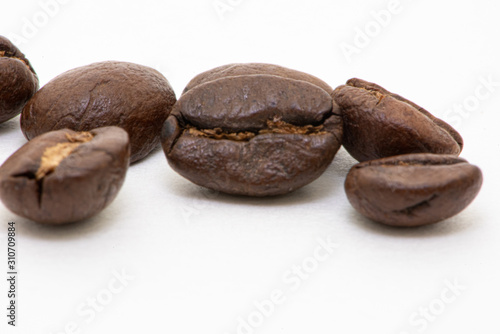 Close up of coffee beans on a white background
