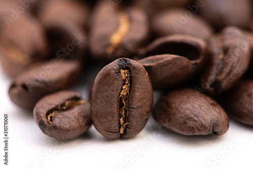 Close up of coffee beans on a white background