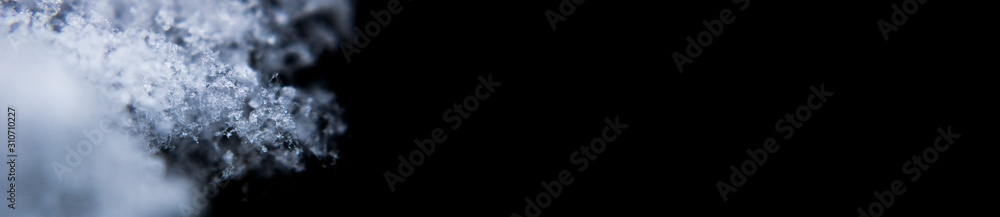 Seasonal Snow Snowflake Ice Crystal Photo Banner with a Dark Background Seasonal Snow Snowflake Ice Crystal Photo Banner with a Dark Background