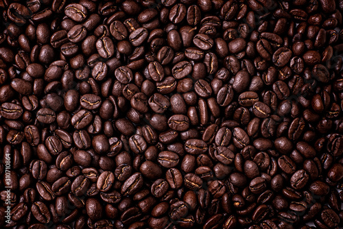 Pile of coffee beans on a white background