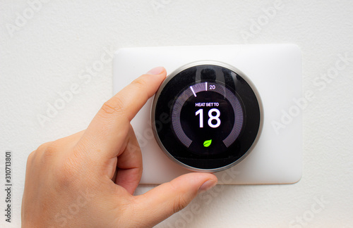 Canvas Print Smart Thermostat with a person saving energy with a soft shadow