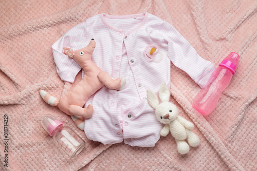 Fotografie Baby clothes and accessories on plaid