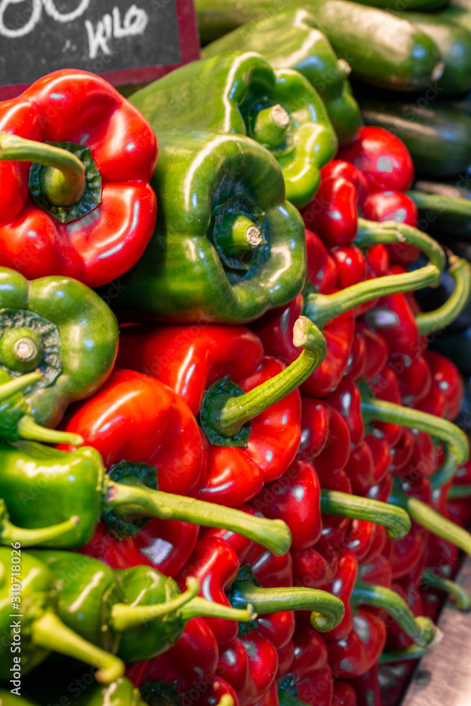 Green and red hot peppers at the market