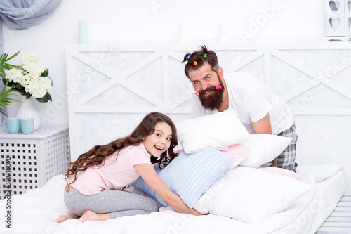 She needs his unconditional love. Happy man and small child have fun in bedroom. Father and daughter relationship. Sharing love and laugh. Family love. Parental love. Loving home
