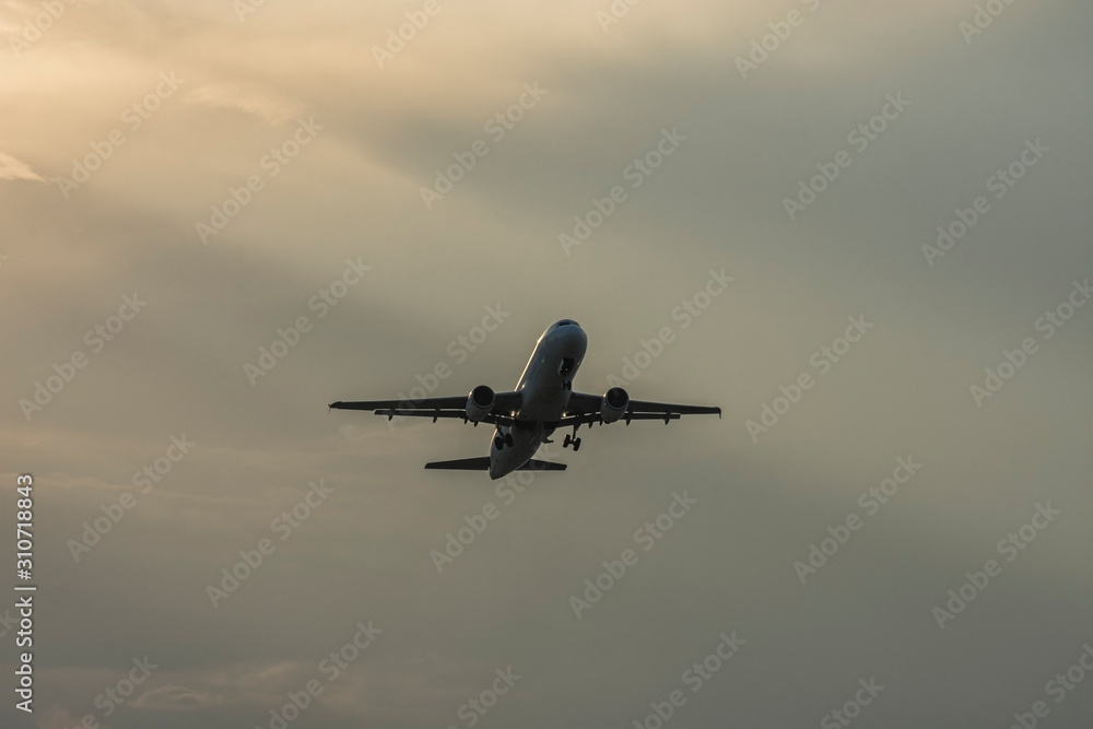 Landing airplane at colorful sunset. Silhouette, selective focus. Landscape, background. Landing airplane at colorful sunset. Silhouette, selective focus. Landscape, background.