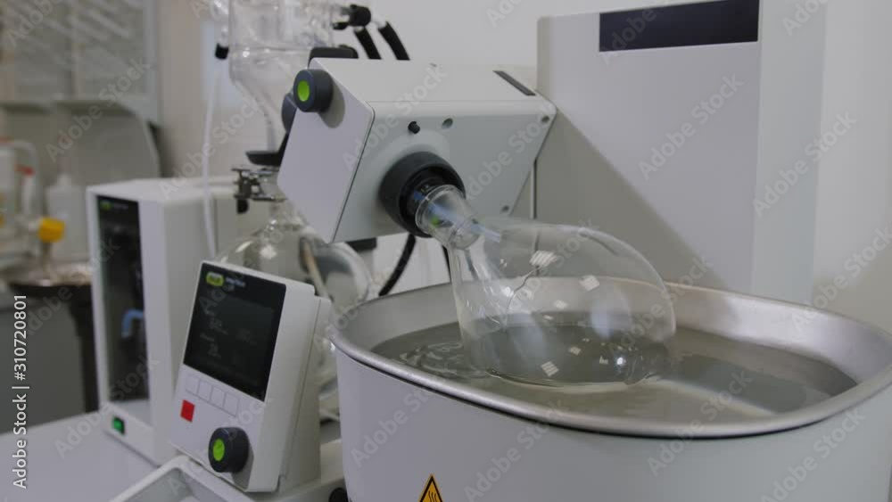 Rotating Lab Tank Rotary vacuum evaporator in chemical laboratory. Mechanism with ...