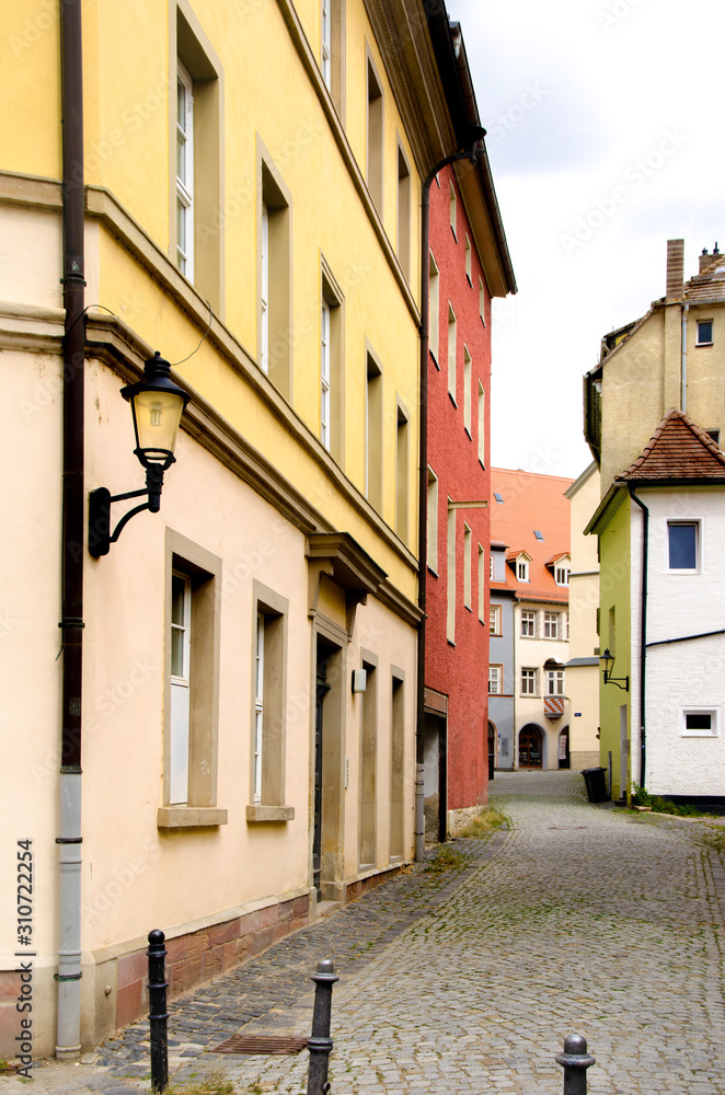 colored houses on a quiet old European street