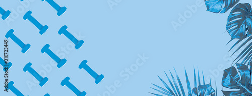 Blue dumbbell pattern on classic blue background with copy space.