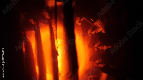 Inside of rotary burning kiln or furnace. Industrial production process of cement clinker or expanded clay. Clinkers tumble in cooling device. 