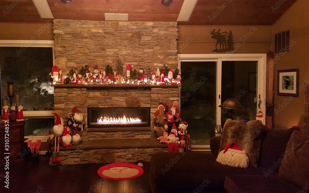 Cozy Home with Warm, Glowing Stone Fireplace in the Christmas Season Cozy Home with Warm, Glowing Stone Fireplace in the Christmas Season