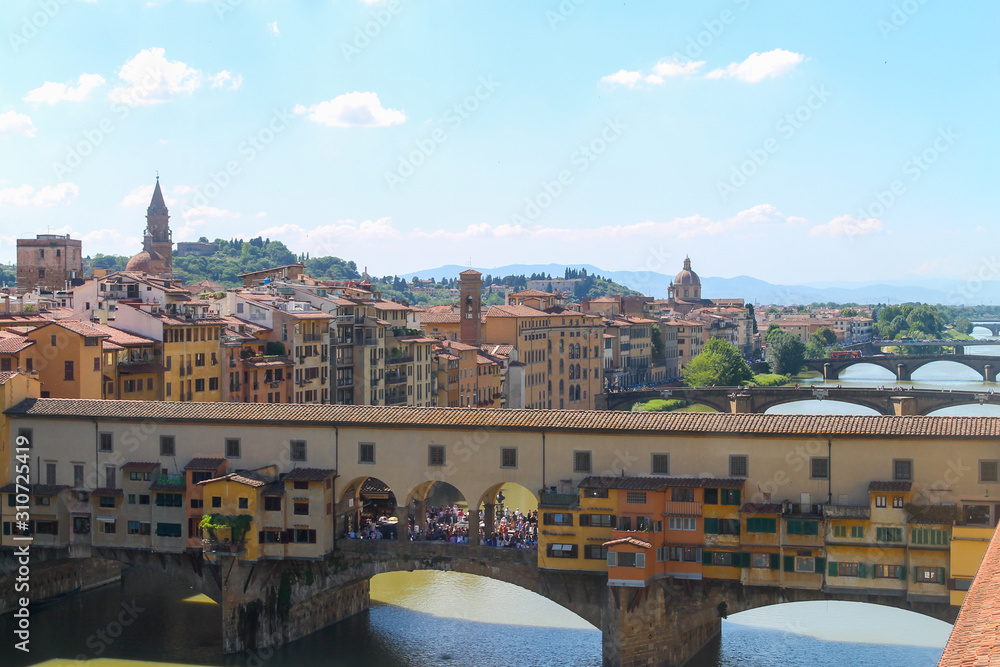 Panoramic view of The Ponte Vecchio or Old Bridge in Florence Italy, famous  tourist destination. 