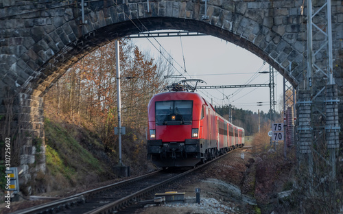 Red fast train from Austria to Czech republic in station Rybnik