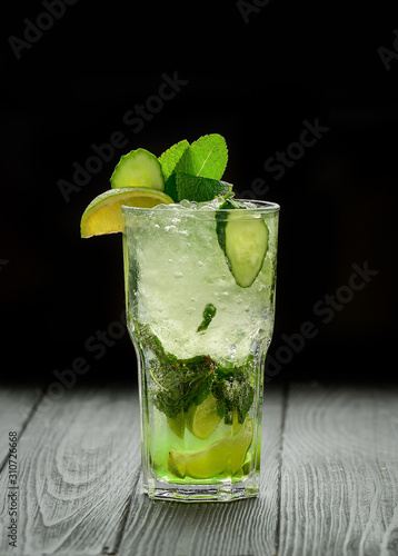 Mojito drink on vintage wooden background