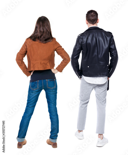 Back view of couple in winter jacket.