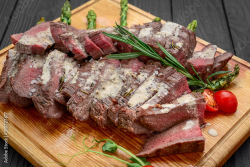 Beef sliced on wooden background