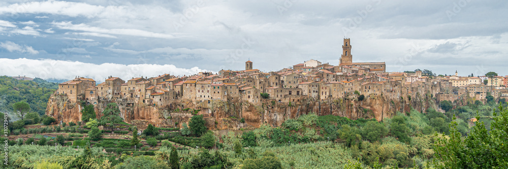 View of the medieval village Pitigliano founded in Etruscan time on the tuff hill, Tuscany, Italy. Wide banner