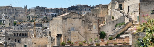 Fototapeta Naklejka Na Ścianę i Meble -  Matera is a city located on a rocky outcrop in Basilicata, in Southern Italy. It includes the area of the Sassi, a complex of Cave Houses excavated in the mountain.