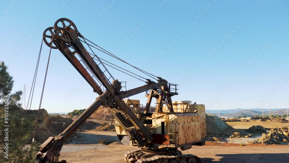 Excavator machine abandoned in old mine. Excavator machine abandoned in old mine.