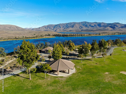 Aerial view of little park in front of Otay Lake City Reservoir with blue sky and mountain on the background, Chula Vista, California. USA