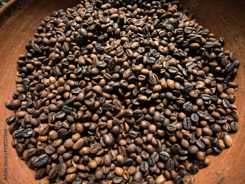 Roasted coffee beans on a clay bowl © VUSPhotography.com