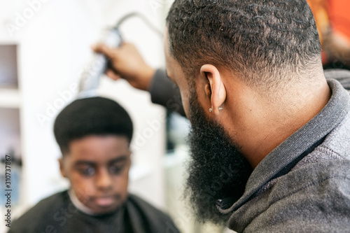 Barber: Young Man Getting A Haircut photo