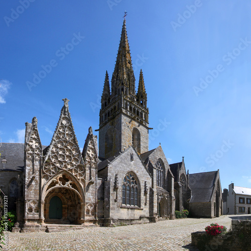 Gothic city church of Pont-Croix with its high pointed steeple, Bretagne in France