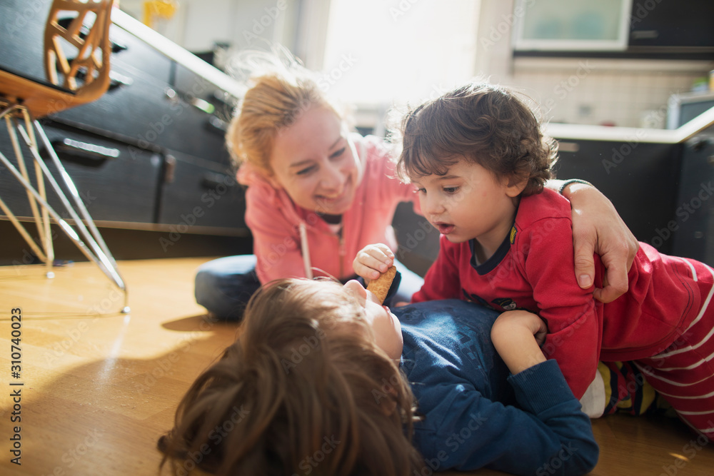 Mother having fun with her kids indoor Mother having fun with her kids indoor