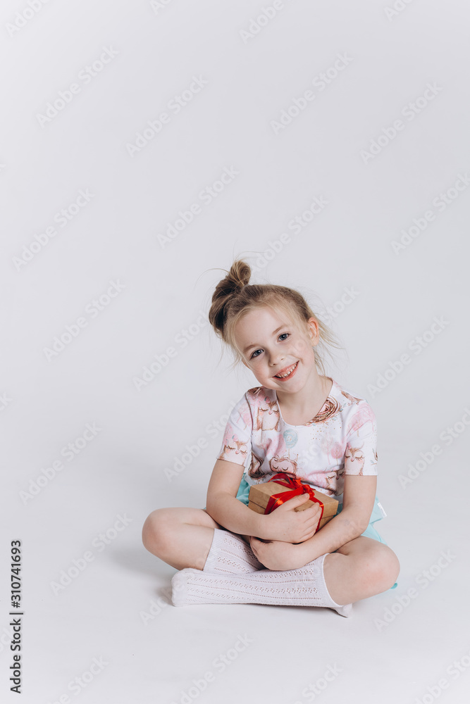 Close up portrait of little cute adorable girl posing alone on isolated white background in studio. Childhood, fashion kids, baby model concept Close up portrait of little cute adorable girl posing alone on isolated white background in studio. Childhood, fashion kids, baby model concept