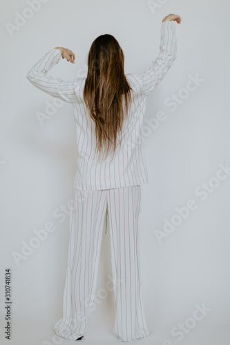 Faceless girl alone in striped pajamas