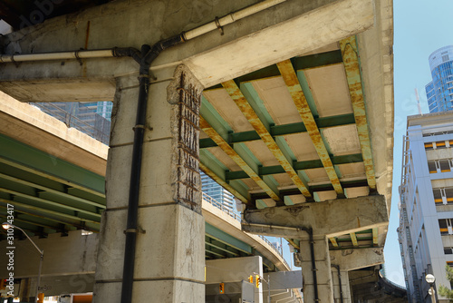 Crumbling concrete and rust under the Gardiner Expressway in downtown Toronto