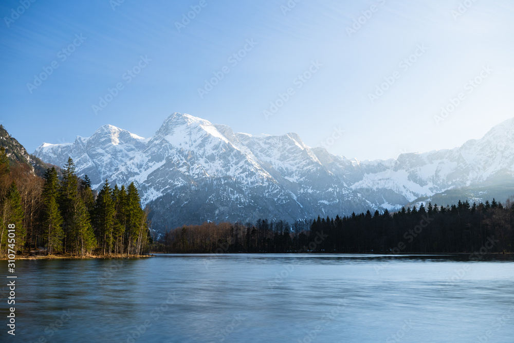 Mountain Lake and Forest Under a Blue Sky