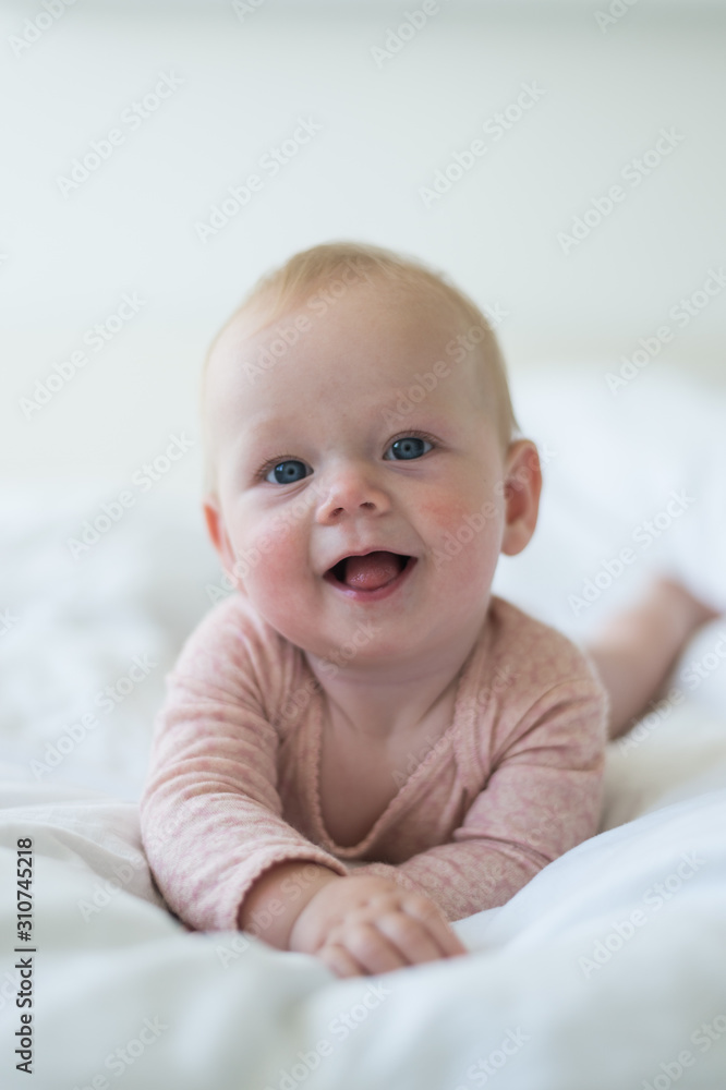 Baby girl playing with her toys and feet Baby girl playing with her toys and feet