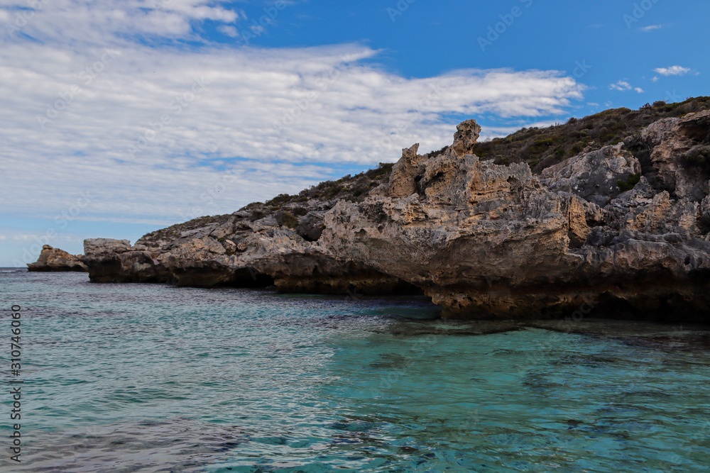 Rocky coastline with clear water on a summer day Rocky coastline with clear water on a summer day
