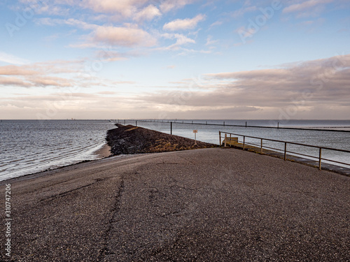 Norddeich  Germany. 7 December 2019.  Concrete dam on the North Sea coast in morning light.