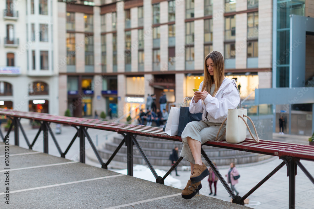 shopping girl talking by mobile