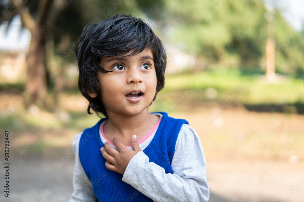 Outdoor portrait of little girl smiling and making fun Outdoor portrait of little girl smiling and making fun