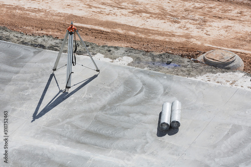 Topographyc tripod on a construction site photo