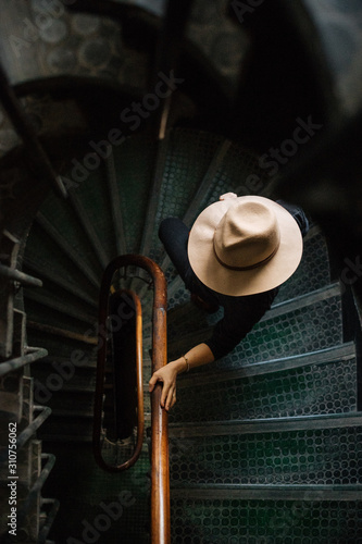 Unrecognizable person walking down steps photo