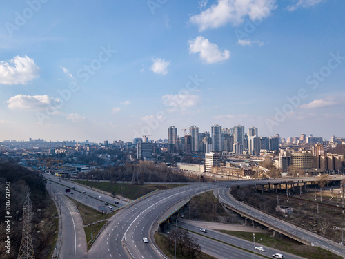 Road junction and new buildings under construction of Pechersk District, city Kiev Ukraine on a background of blue sky. Aerial view from drone.