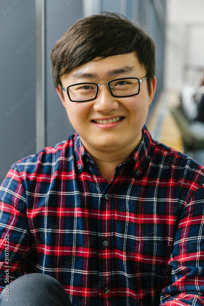Casual Portrait of Asian Man Smiling with Eyeglasses Casual Portrait of Asian Man Smiling with Eyeglasses