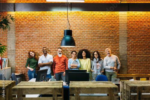 Big group of business people posing in creative office photo