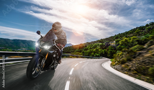 motorbike on the road riding. having fun driving the empty highway on a motorcycle tour journey