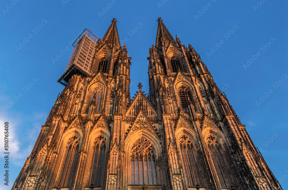 Front facade of Cologne Cathedral during sunset