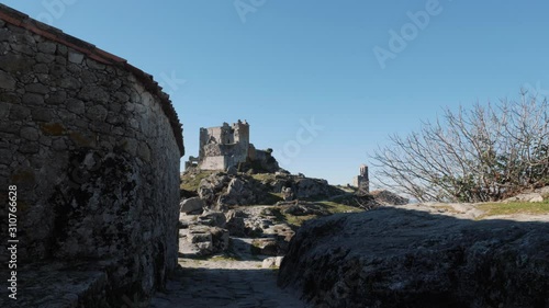 Ruined Bell tower and castle in Spain, Extremadura. Trevejo photo