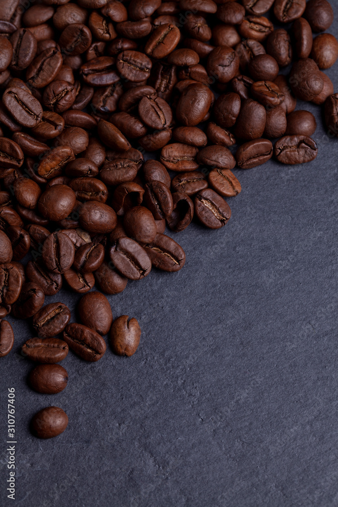 Roasted coffee beans on granite background Roasted coffee beans on granite background
