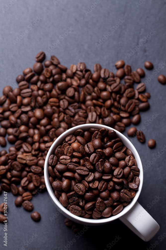 Roasted coffee beans on granite background Roasted coffee beans on granite background