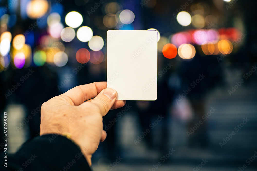 Blank Message Card In Busy City At Night Communication Concept Blank Message Card In Busy City At Night Communication Concept